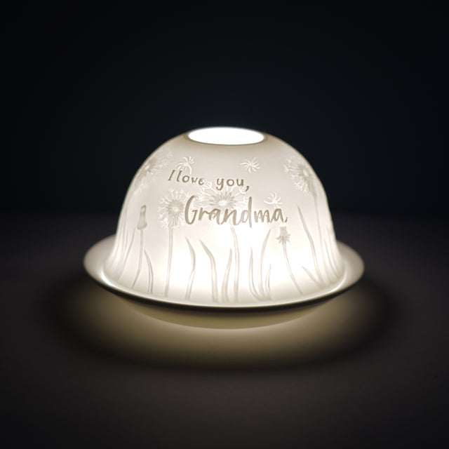 Cello porcelain tealight holder dome, in our I love you Grandma design. This design displays the text I love you Grandma over Dandelions. We offer a wide range of porcelain tealight holders to let you choose your show-stopping piece.