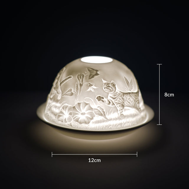 Cello porcelain tealight holder dome, in our kitten design. This design displays kittens with big loving eyes playing with butterflies dancing over their head. We offer a wide range of porcelain tealight holders to let you choose your show stopping piece.