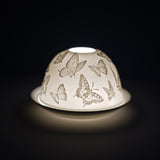 Cello porcelain tealight holder dome, in our Butterflies design. This design displays scattered butterflies surrounding the dome. We offer a wide range of porcelain tealight holders to let you choose your show-stopping piece and show it off with pride when guests and family are over.