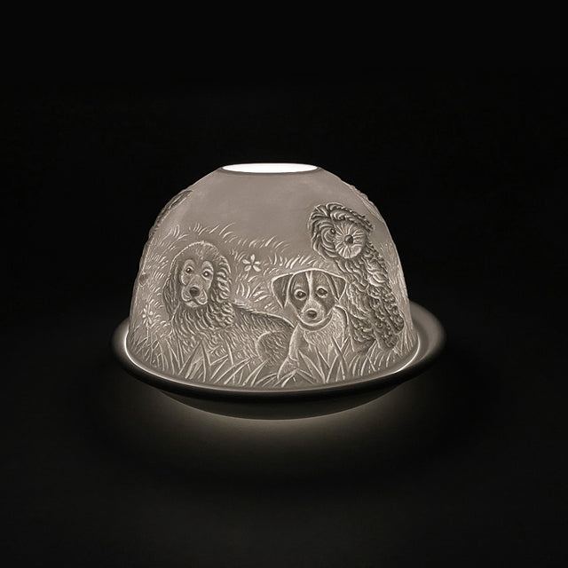 Cello porcelain tealight holder dome, in our puppies design. This design displays an image of puppies gathered together and surrounded by long grass. We offer a wide range of porcelain tealight holders to let you choose your show-stopping piece.