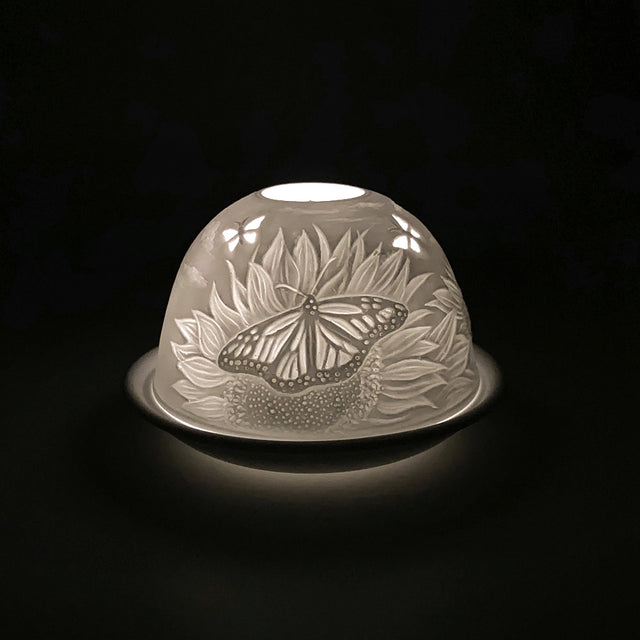 Cello porcelain tealight holder dome, in our sunflower and butterfly design. This design displays an stunning image of a butterfly landing on a sunflower. We offer a wide range of porcelain tealight holders to let you choose your show-stopping piece and show it off with pride.

