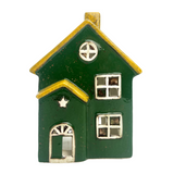 Green house-shaped ornament with yellow roof on a white background