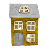 Ceramic tealight holder house with a gray roof and yellow body on a white background