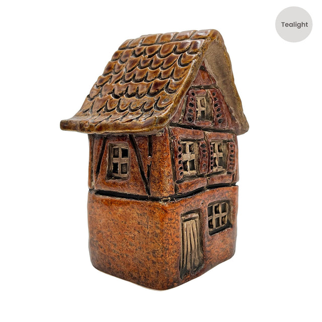 Side view of the Briarwood Hollow orange ceramic tealight house from Cello’s Tales from the Village collection with rich autumnal glaze.
