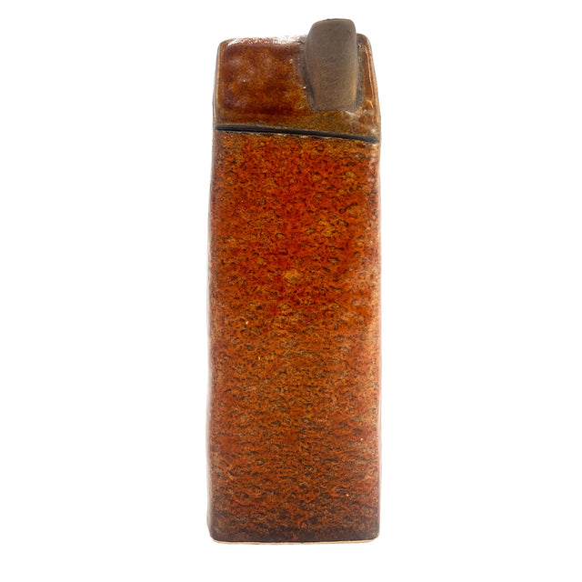 Rear view of the Gatekeeper’s Lodge brown ceramic LED house highlighting smooth glaze finish and chimney detail.