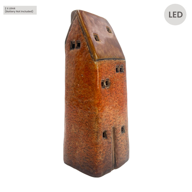 Side view of the Cello Tales from the Village Gatekeeper’s Lodge rustic brown ceramic LED house showing handcrafted windows and textured glaze.