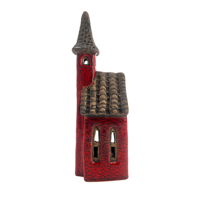 Opposite side angle of the Crimson Tower pottery house highlighting spire structure, roof tiles, and intricate window design.