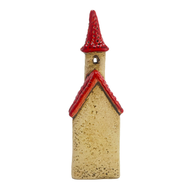 Rear view of the Ivory Tower village pottery house showing smooth ivory surface and high-gloss red roof.