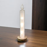 White Gleneagles Moving Stars LED USB Glass Candle glowing on a modern living room shelf, casting soft star-like light for a cosy and elegant indoor Christmas ambience.