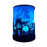 Cello Haunted House Electric Wax Melt Burner illuminated in blue light, creating a mystical and calming glow for Halloween décor.