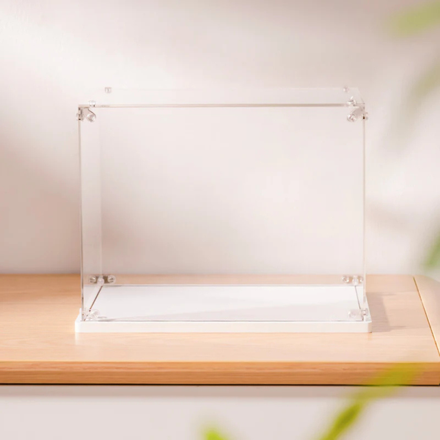 Clear acrylic ROBOTIME Rolife Kits Display Box TGF01 on a wooden surface with a light background