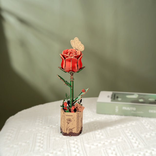 ROBOTIME Rowood Red Rose Wooden Flowers in a decorative pot on a textured surface.