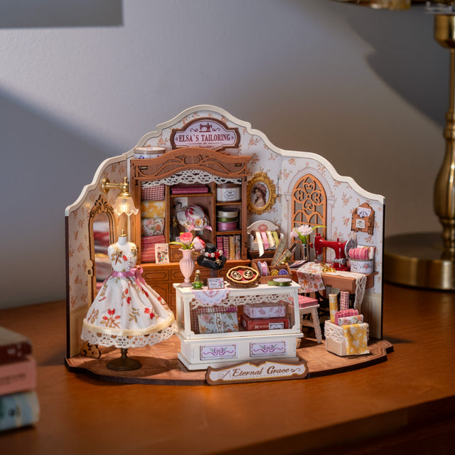 Rolife kits Miniature tailor's Elsa's tailoring shop model with various items on a wooden surface Robotime