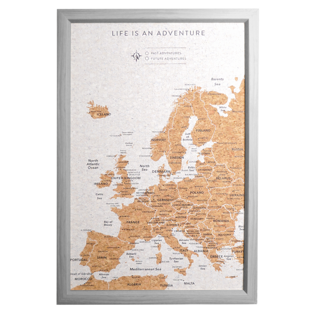 Splosh Travel Map â€“ Small Europe Map with Grey Frame, Gold Land Detail, and Cork Board Backing. Features personalised labels for your pins, tracking past and future travels across Europe. Includes 'Life is an Adventure' text and hooks for easy wall mounting, perfect for home dÃ©cor or as a thoughtful gift