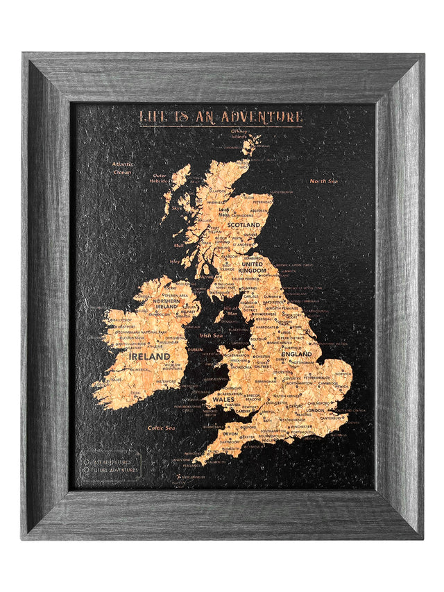 Splosh Travel Map â€“ UK & Ireland Desk Map with Black Frame, Gold Land Detail, and Cork Board Backing. Designed for desk use with a sturdy leg for support and anti-slip material. Features personalised labels for your pins, tracking past and future travels across the UK and Ireland. Includes 'Life is an Adventure' text, ideal for home or office dÃ©cor.