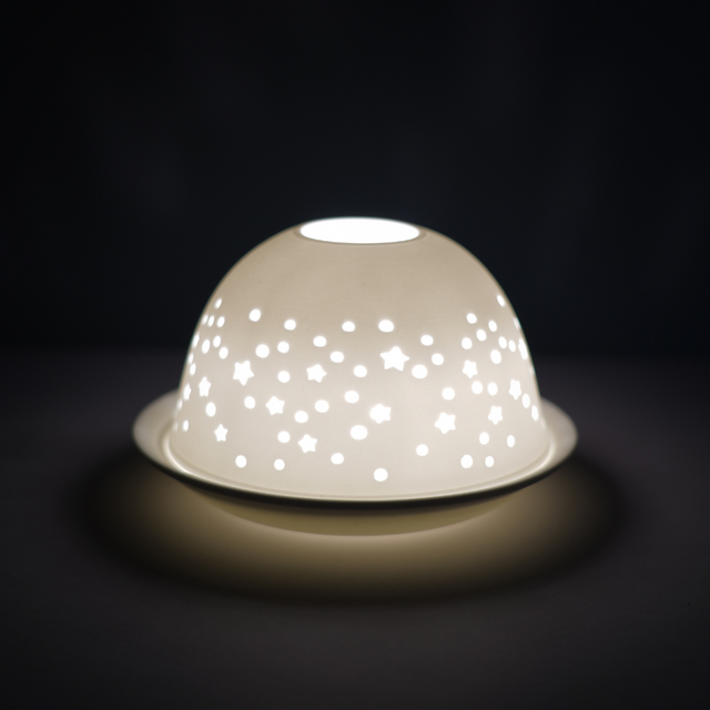 Cello porcelain tealight holder dome, in our Starry Night design. This design displays stars scattered over the surface of the dome. We offer a wide range of porcelain tealight holders to let you choose your show-stopping piece and show it off with pride when guests and family are over. 