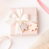 Best Friends puzzle piece keepsake pins presented in a gift box with ribbon