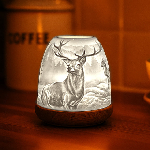 Porcelain Highland Stag tealight dome glowing in warm cosy setting