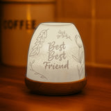 Best Best Friend porcelain tealight dome glowing warmly on wooden table
