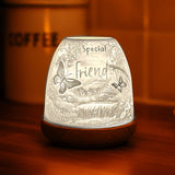 Porcelain Special Friend tealight dome illuminated with warm orange glow.