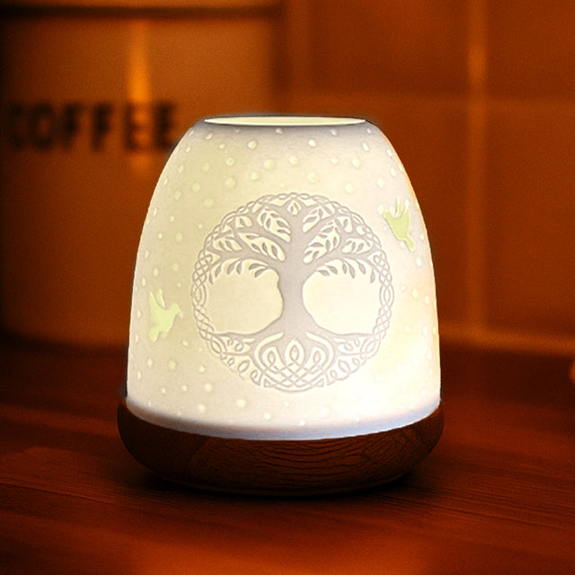 Tree of Life Cello tealight dome glowing warmly in home interior setting