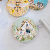 Splosh Cottage Grove Green Cottage ceramic coaster displayed with other ceramic coasters in the collection.