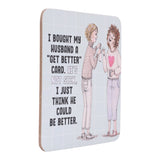 Drinks coasters with illustration of two people and humorous text on a white background