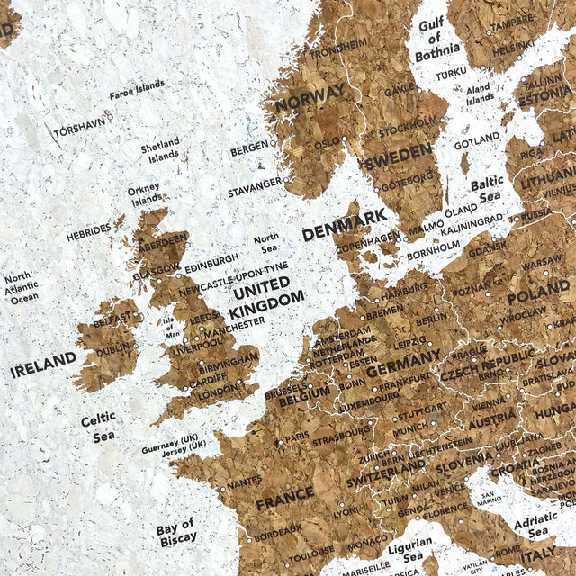 Europe travel map cork board detail with gold and silver pins
