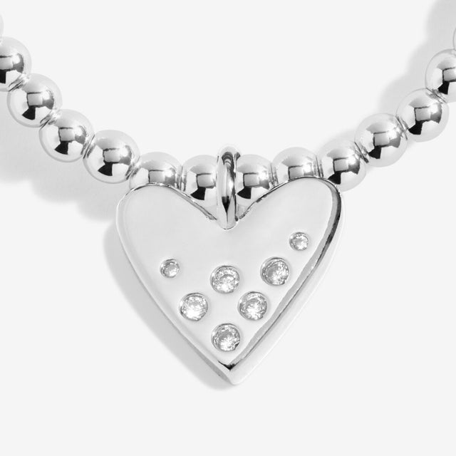Close-up of crystal heart charm on Joma Jewellery 16th birthday bracelet