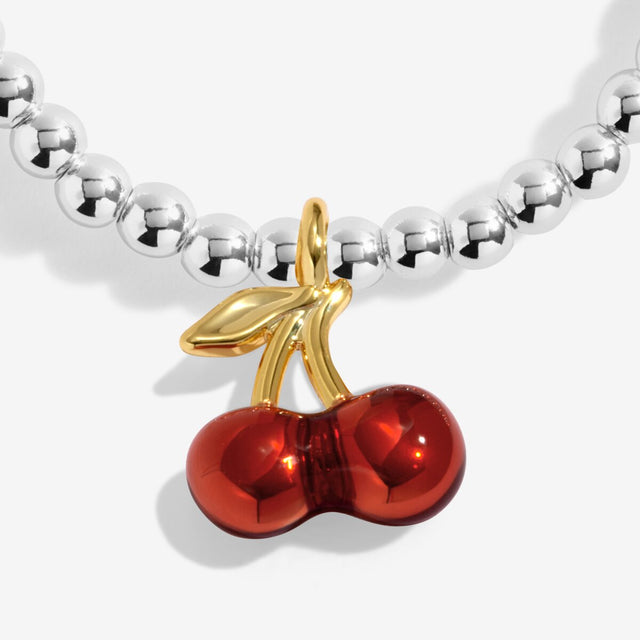 Close-up of cherry charm on Joma Jewellery A Little Vibes Cherry On Top silver-plated bracelet