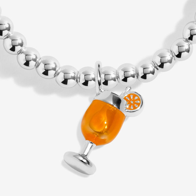 Close-up of spritz glass charm on Joma Jewellery A Little Vibes It’s Spritz O’Clock silver-plated bracelet