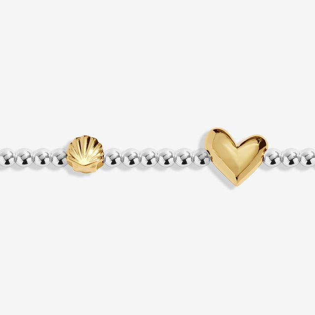 Close-up of heart charm on Joma Jewellery August birth month bracelet