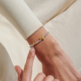 Joma Jewellery August birth month silver and gold-plated bracelet worn on wrist