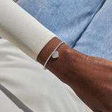 Joma Jewellery Confetti A Little 50th Birthday silver-plated bracelet worn on the wrist