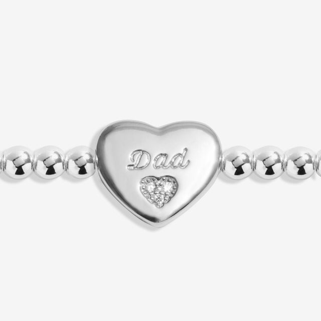 Close up of heart charm engraved Dad on silver remembrance bracelet