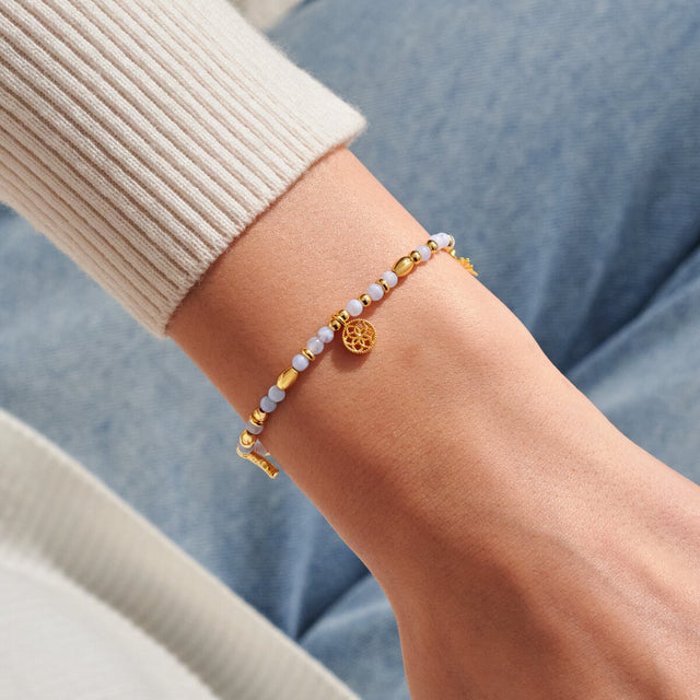 Joma Jewellery Dreamer gold affirmation bracelet worn on wrist