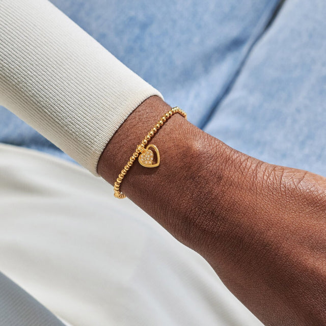 Joma Jewellery gold First My Mum Forever My Friend bracelet worn on wrist