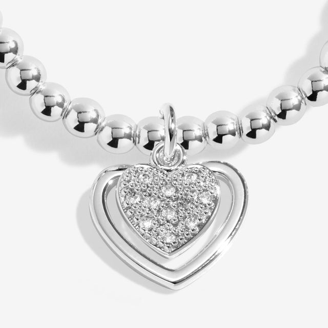 Close up of layered heart charm on silver mum bracelet