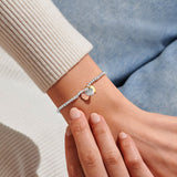 Joma Jewellery Friendship mixed metal heart charm bracelet worn on wrist