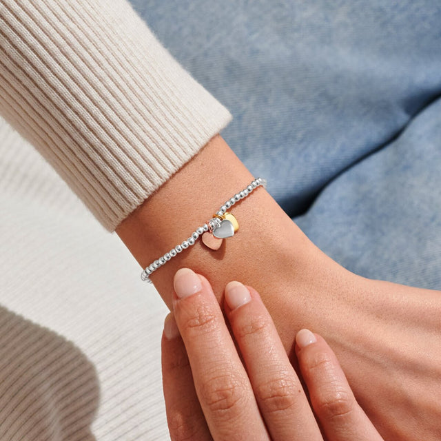 Joma Jewellery Friendship mixed metal heart charm bracelet worn on wrist