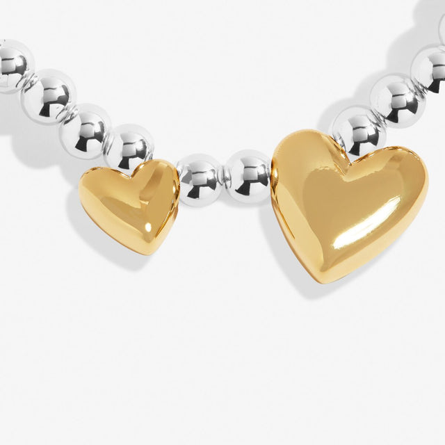 Gold heart charm detail on adult friendship bracelet
