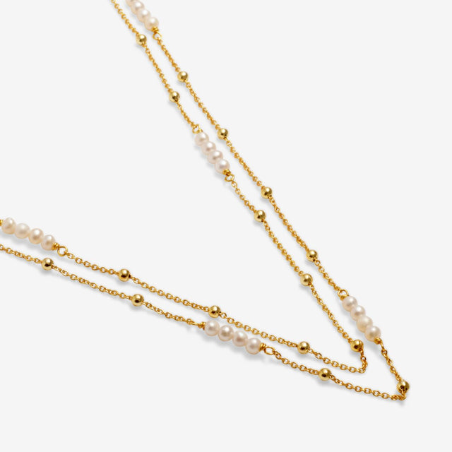 Freshwater pearl detail on gold pearl necklace