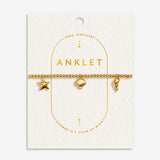 Joma Jewellery gold shell charms anklet on textured buttercream card