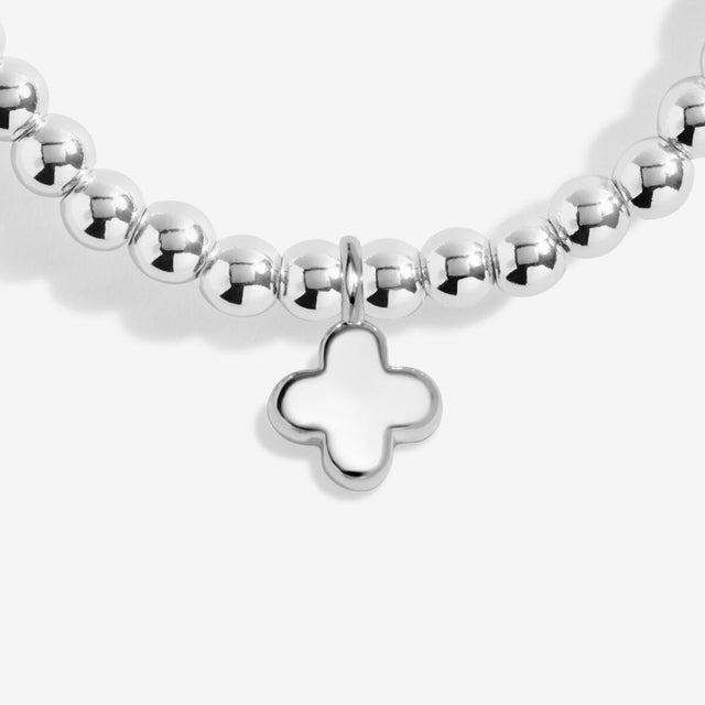 Silver cross charm detail on Happy Birthday charm bracelet