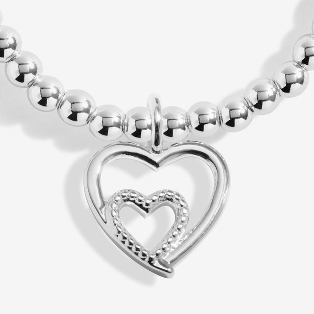 Close up of double heart charm on silver Mother’s Day bracelet