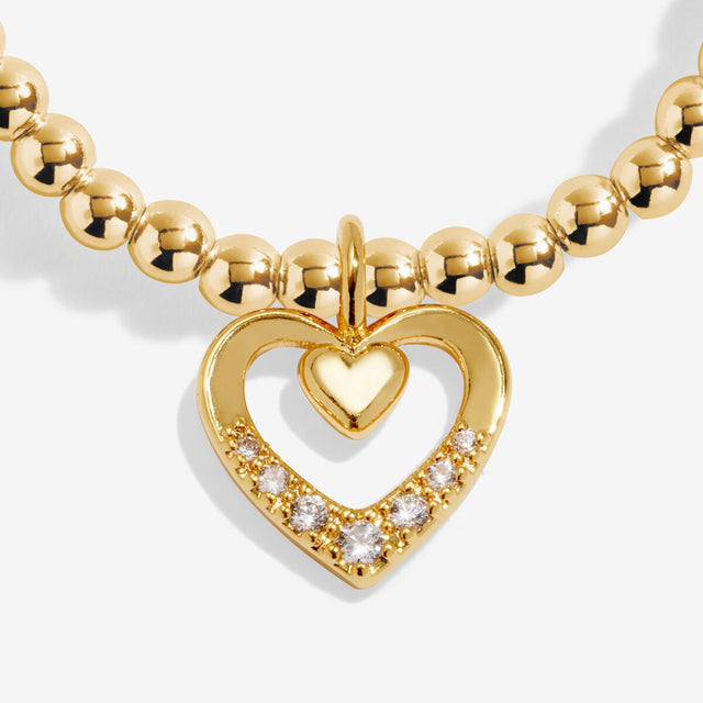 Close up of gold double heart charm on Mother’s Day bracelet