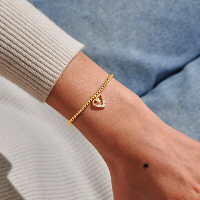 Joma Jewellery gold Happy Mother’s Day bracelet worn on wrist