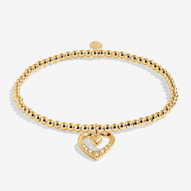 Gold plated beaded bracelet with double heart charm