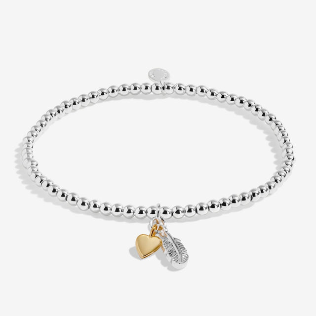 Silver plated bracelet with gold heart charm and silver feather charm