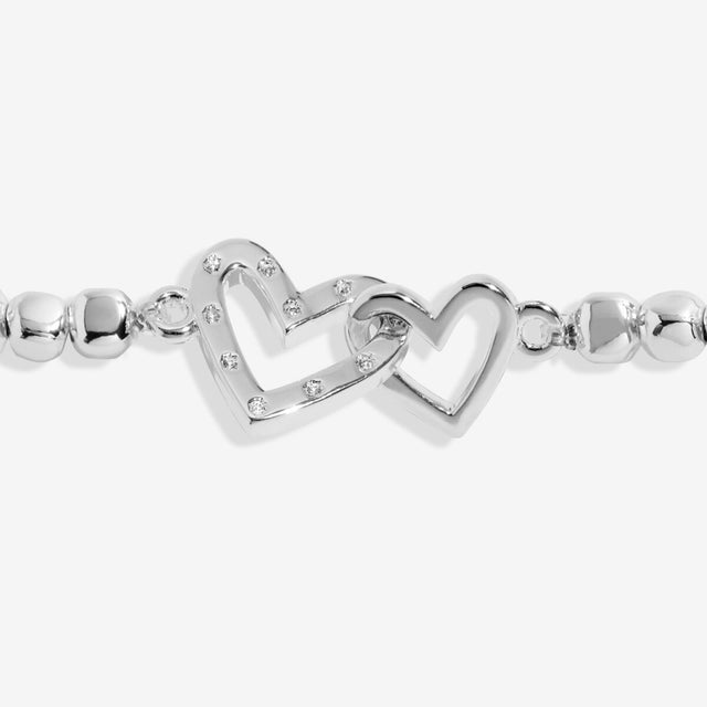 Close up of interlinked heart charms on Best Mam Ever bracelet